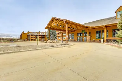 an empty driveway in front of a building at 2 Mi to Granby Ranch Mtn Condo with Hot Tub! in Granby
