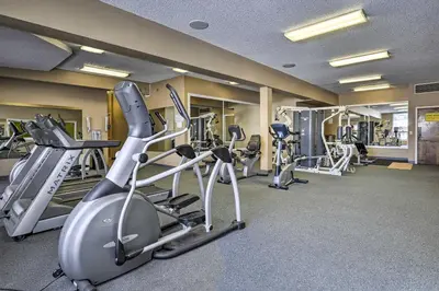 a gym with several treadmills and exercise bikes at 2 Mi to Granby Ranch Mtn Condo with Hot Tub! in Granby
