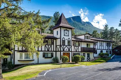 a large white building with a clock tower at Estes Park Vacation Rental 1 Mi to National Park in Estes Park