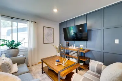 a living room with a couch and a table at Loveland Retreat with Bicycles, Deck and Fire Pit! in Loveland