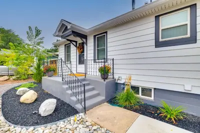 a home with stairs and rocks in front of it at Loveland Retreat with Bicycles, Deck and Fire Pit! in Loveland