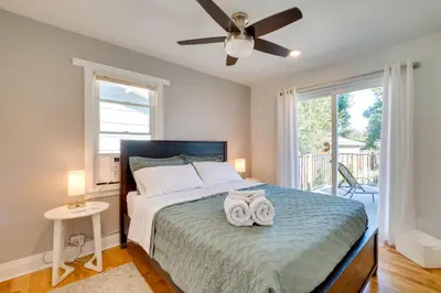 a bedroom with a bed with two towels on it at Loveland Retreat with Bicycles, Deck and Fire Pit! in Loveland