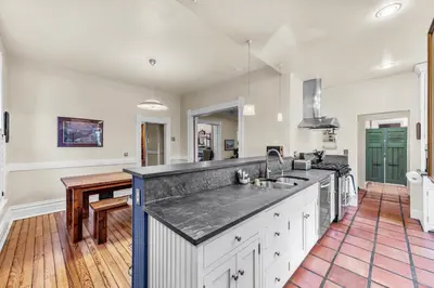 a kitchen with a sink and a counter top at 151 W 2nd Ave - Denver in Denver