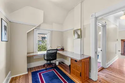 a home office with a desk and a chair at 151 W 2nd Ave - Denver in Denver