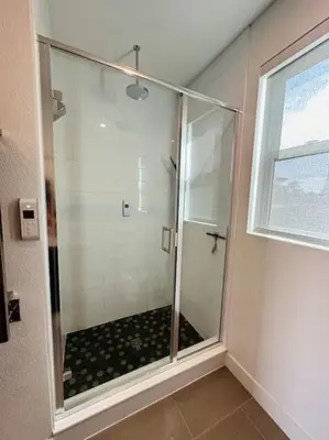 a shower with a glass door in a bathroom at Downtown Denver Smart House in Denver