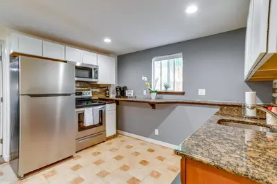 a kitchen with a stainless steel refrigerator at 9 Mi to Dtwn Denver Aurora Vacation Rental in Aurora