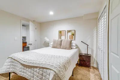 a white bedroom with a bed and a window at 9 Mi to Dtwn Denver Aurora Vacation Rental in Aurora