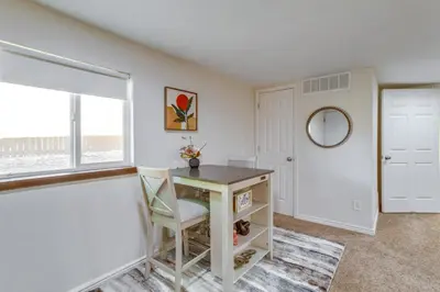 a room with a table with a chair and a window at 9 Mi to Dtwn Denver Aurora Vacation Rental in Aurora