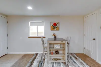 a white room with a table and two chairs at 9 Mi to Dtwn Denver Aurora Vacation Rental in Aurora