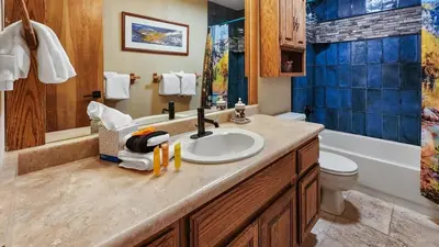 a bathroom with a sink and a toilet and a tub at Tranquil 2BR Near Trails and Free Shuttle in Silverthorne