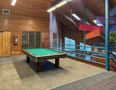 a pool table in the middle of a room at Tranquil 2BR Near Trails and Free Shuttle in Silverthorne