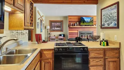 a kitchen with a sink and a stove at Tranquil 2BR Near Trails and Free Shuttle in Silverthorne