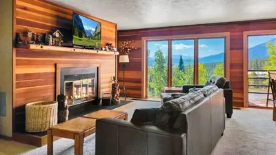 a living room with a couch and a fireplace at Tranquil 2BR Near Trails and Free Shuttle in Silverthorne