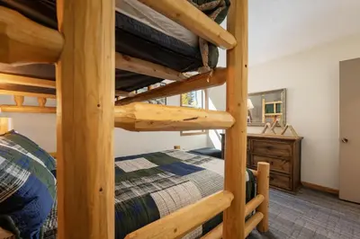 a bedroom with two bunk beds in a room at Snowblaze A24 condo in Winter Park
