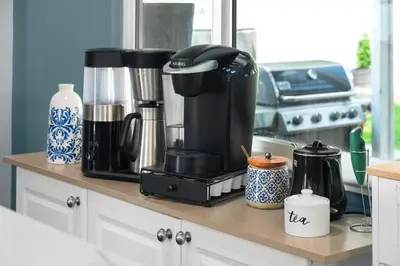 a coffee maker on a counter in a kitchen at Luxury 3b-3b- Hot tub, Sauna, Personal Gym in Denver