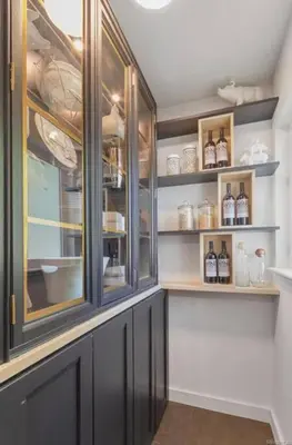 a kitchen with glass cabinets and shelves with bottles at Luxury 3b-3b- Hot tub, Sauna, Personal Gym in Denver