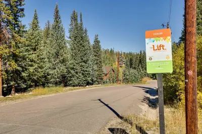 a street sign on the side of a road at Winter Park Condo with Sleeping Loft - Near Main St in Winter Park