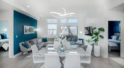 a living room with a table and a couch at Level-Up Elegance | Espadin LoHi in Denver