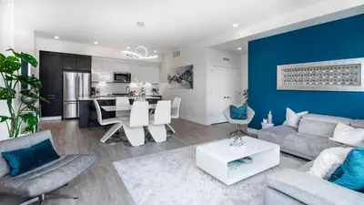 a living room with a couch and a table at Level-Up Elegance | Espadin LoHi in Denver