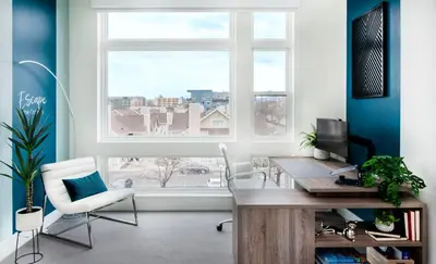 an office with a desk and chairs and a window at Level-Up Elegance | Espadin LoHi in Denver