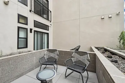 two chairs and a table on a balcony at Southwestern Charm | Espadin LoHi in Denver