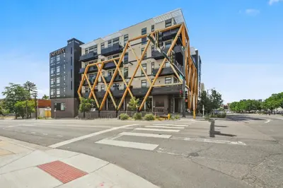 a large building on the corner of a street at Sleek & Chic Vibes | Espadin LoHi in Denver