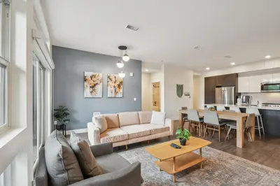 a living room with a couch and a table at Sleek & Chic Vibes | Espadin LoHi in Denver