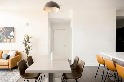 a dining room with a table and chairs at Skytop Perspective | Espadin LoHi in Denver