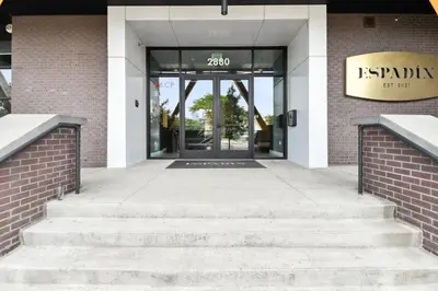 an entrance to a building with a revolving door at Natural Influence | Espadin LoHi in Denver