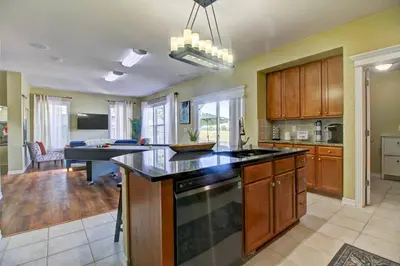 a kitchen with an island in the middle of a room at Lakeview - Gameroom - Pool Table in Henderson