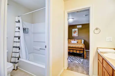 a bathroom with a shower and a toilet and a sink at Lakeview - Gameroom - Pool Table in Henderson