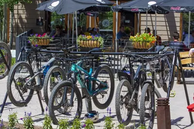 a group of bikes parked next to a table with flowers at Base Camp at Iron Horse,,, townhouse in Winter Park