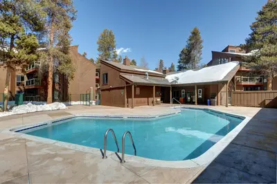 a swimming pool in front of a house at Wild Irishman 2 bed 2 bath retreat WIBH in Keystone