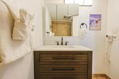 a bathroom with a sink and a mirror at Wild Irishman 2 bed 2 bath retreat WIBH in Keystone