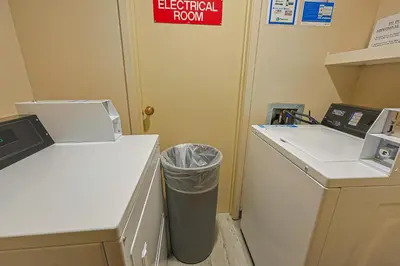 a laundry room with a trash can next to a door at Wild Irishman 2 bed 2 bath retreat WIBH in Keystone