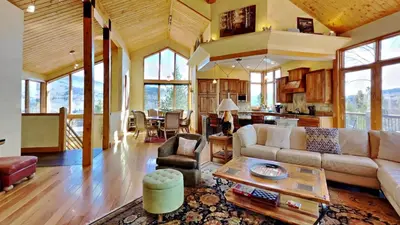 a living room with a couch and a table at CoCo Chalet in Silverthorne