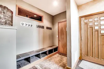 a walk in wine cellar with a door at CoCo Chalet in Silverthorne