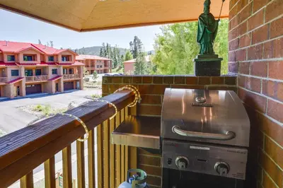 a grill on the balcony of a house at half Mi to Lake Dillon Mtn-View Condo in Frisco in Frisco