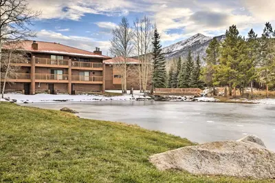 a lodge with a river in front of a building at half Mi to Lake Dillon Mtn-View Condo in Frisco in Frisco