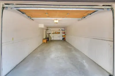a long hallway in a garage with a ceiling at 6 Mi to Winter Park Mtn-View Condo with Balcony! in Fraser
