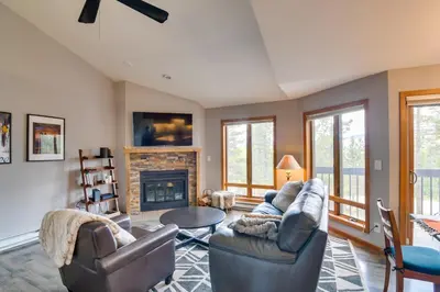 a living room with two couches and a fireplace at 6 Mi to Winter Park Mtn-View Condo with Balcony! in Fraser