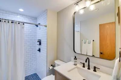 a bathroom with a sink and a shower with a mirror at 6 Mi to Winter Park Mtn-View Condo with Balcony! in Fraser