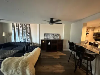 a living room with a couch and a table at Larimer Square, Parking included, at The Windsor in Denver