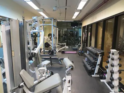 a gym with several treadmills and machines at Larimer Square, Parking included, at The Windsor in Denver