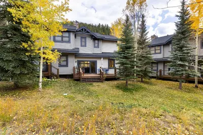 a large house in the middle of a yard at 1952 Northstar townhouse in Keystone