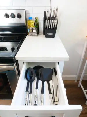 a white kitchen drawer filled with utensils at Private Studio - King Bed - Wifi in Arvada