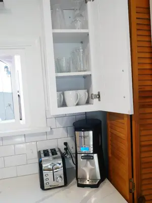 a kitchen with a coffee maker and a microwave at Private Studio - King Bed - Wifi in Arvada