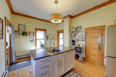 a large kitchen with a sink and a refrigerator at Home in Downtown Idaho Springs 2022-01 in Idaho Springs