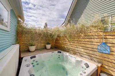 a jacuzzi tub in the backyard of a house at Home in Downtown Idaho Springs 2022-01 in Idaho Springs