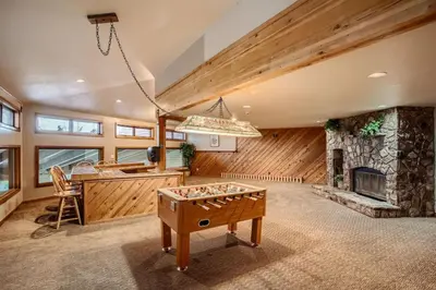 a room with a pool table and a fireplace at Buffalo Ridge G214 in Silverthorne